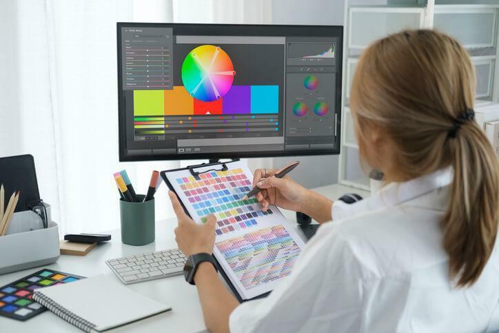 A graphic design diploma holder booking at a color wheel 