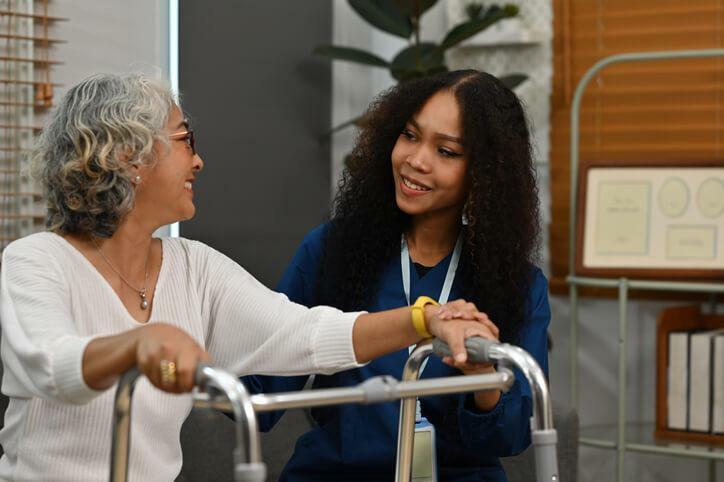 A female community service worker interacting with an elderly client 
