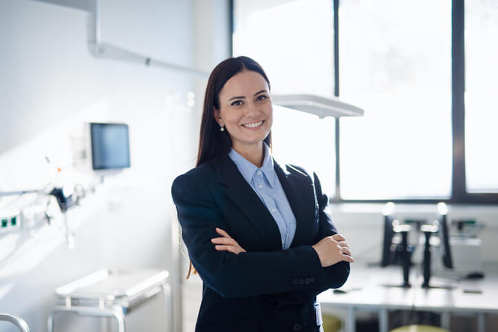 An accomplished female business manager in an office after completing her business management training