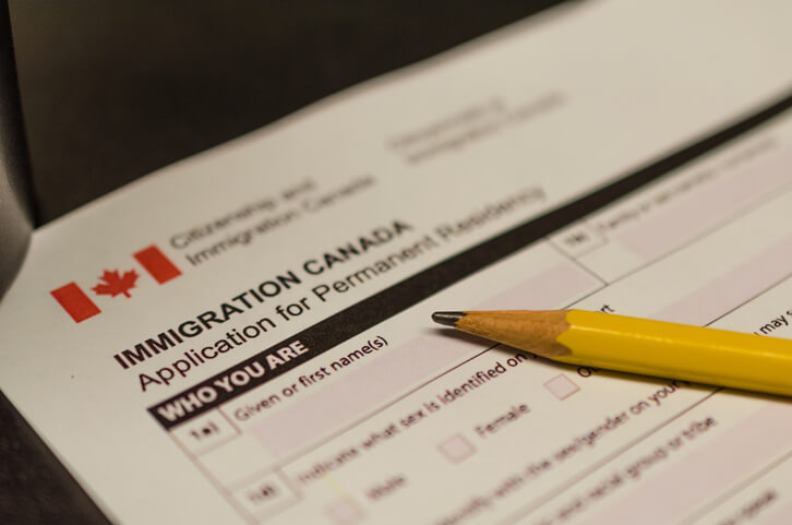 immigration administration training grad filling out a form