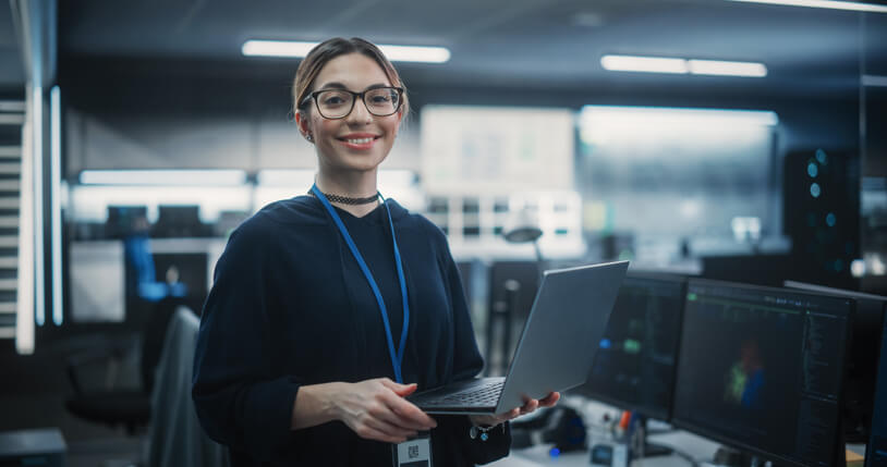 A network administrator training grad working in an office 