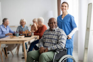 A healthcare aide posing with an elderly patien