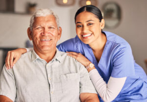 A healthcare aide pushing a client in a wheelchair 