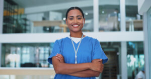 A smiling female health care aide in a hospital 