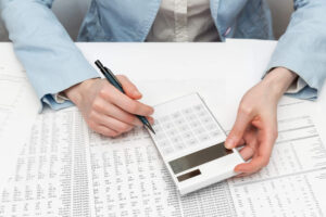 Accounting clerk working on a financial report in an office after completing their accounting administration training