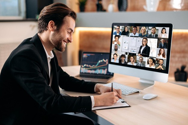 A graduate of a business management diploma program reviewing a virtual project