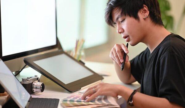 A graphic design student working on a 2025 trend-inspired project