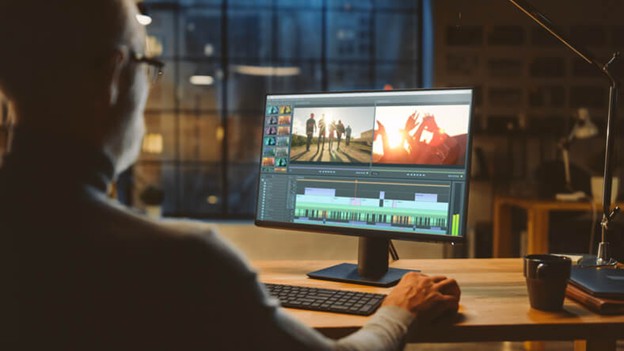 A male graphic design training graduate creating AI-enhanced images