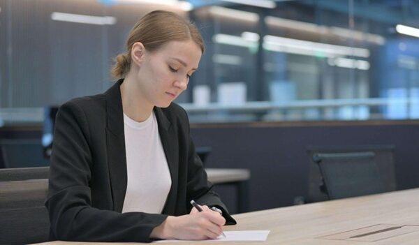 A student in immigration administration training filling out legal forms