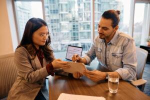  An immigration assistant speaking with a newcomer client