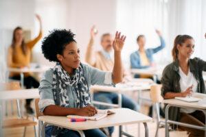 A cohort of budding immigration administration professionals taking classes in a multicultural classroom