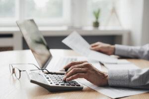 A payroll administration training graduate reviewing AI-generated reports 