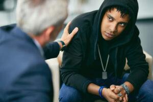 A community service worker supporting a client in a counseling session
