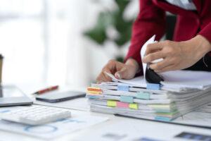An accounting administrator organizing financial reports