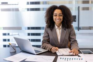 A graduate working in an entry-level accounting assistant position