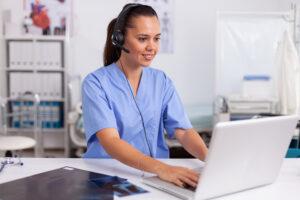 A Medical Office Assistant supporting a virtual telehealth consultation in a clinic 