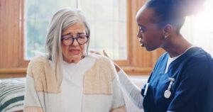 A Health Care Aide training offering emotional support to a senior in care