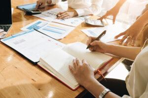 A small business accounting team closing the monthly books