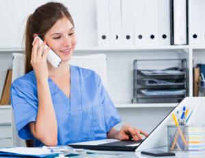 A medical office assistant managing follow-up appointments as part of patient care