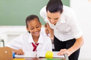 Educational assistant using consistency and boundaries in schools to support student success.