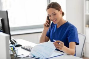 A medical office assistant managing a busy clinic appointment schedule