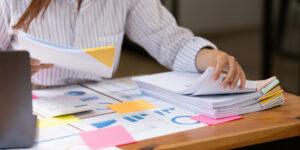 Accounting assistant organizing financial records and documents for an audit