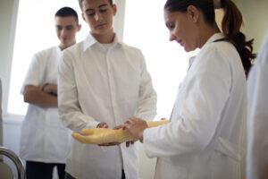 Student receiving hands-on training during practicum experience