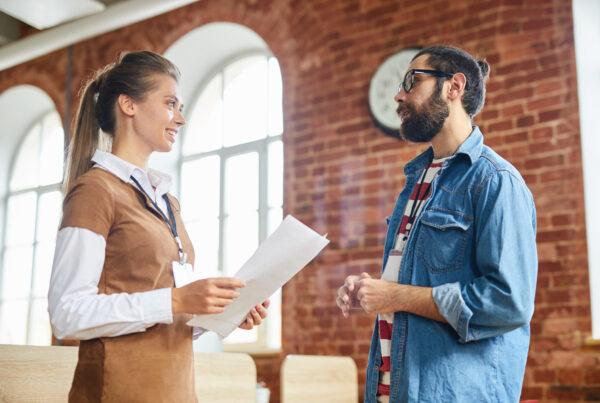 Employer speaking with practicum student about workplace responsibilities