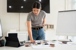 A designer organizing portfolio projects and mockups for professional presentation