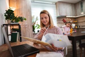 An adult student balancing career training and parenting responsibilities using a planner
