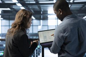 Network administrator assisting a user and translating technical terms into simple language